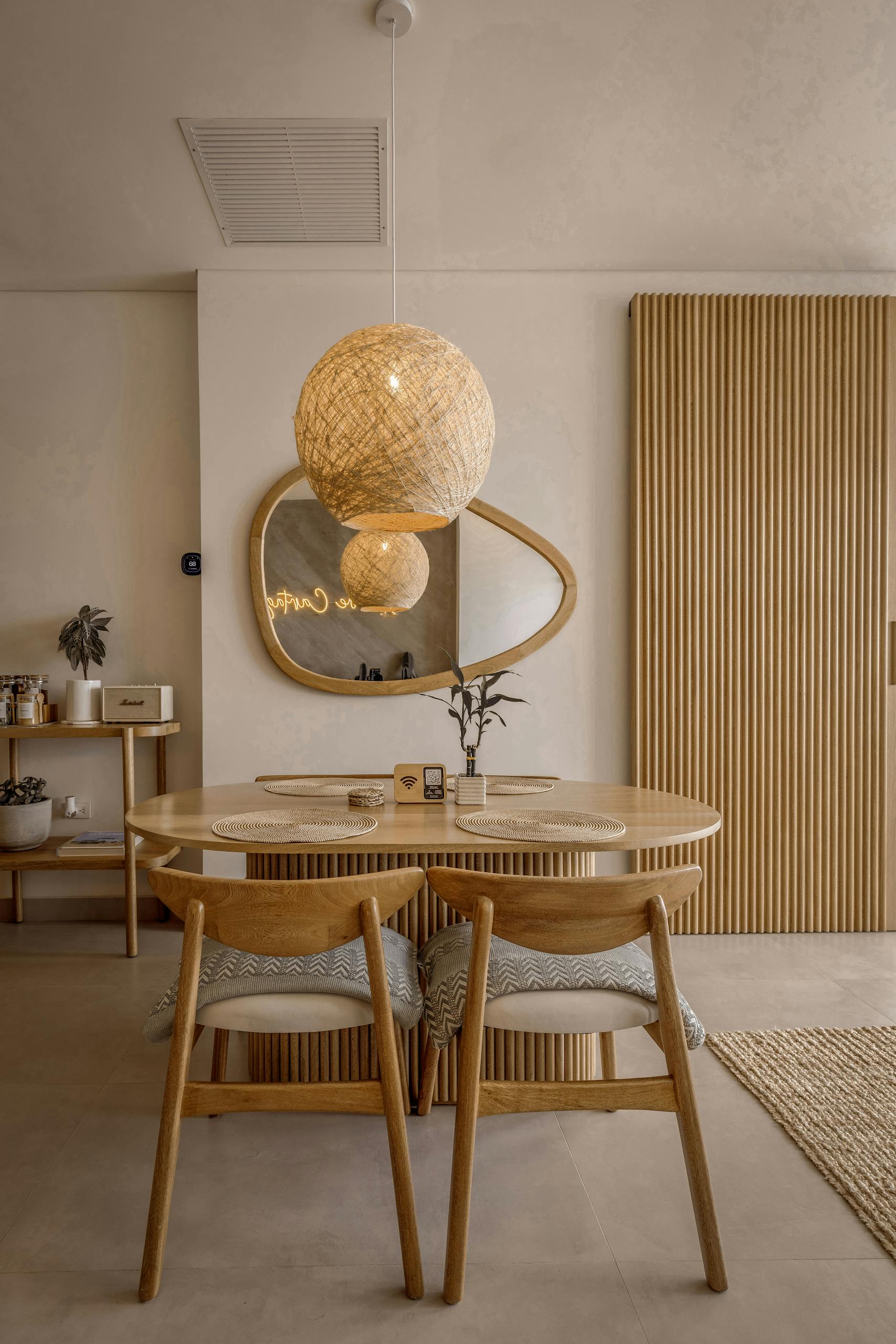 Cozy dining space featuring natural wood furniture and soft lighting ambiance.